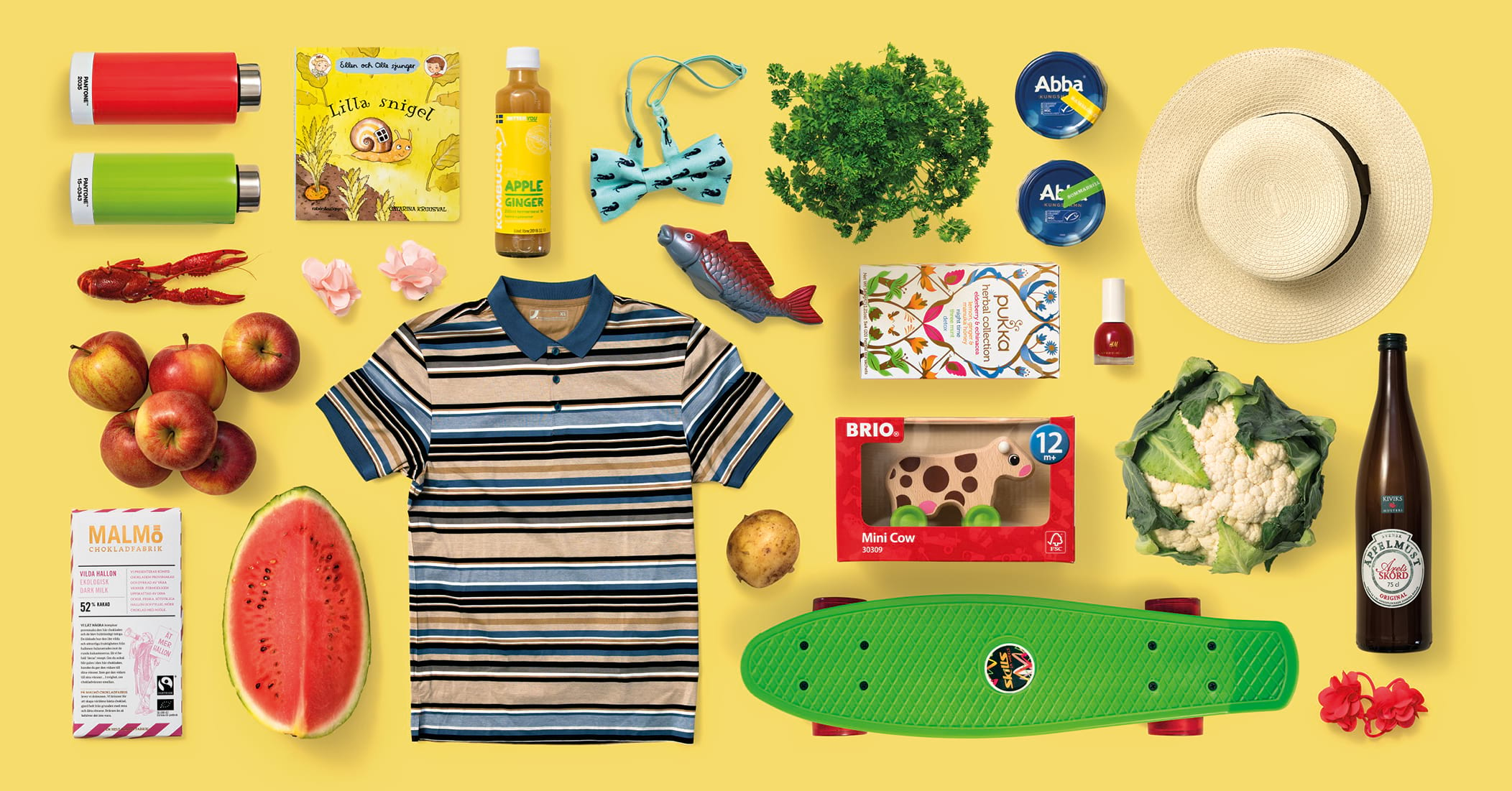 Reklam för Caroli fyllt med produkter och mat som säljs i köpcentrumet i gult