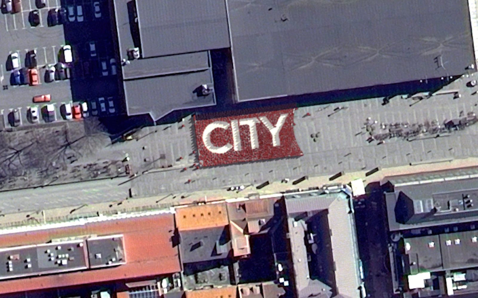 Foto taget från luften över byggnader för city